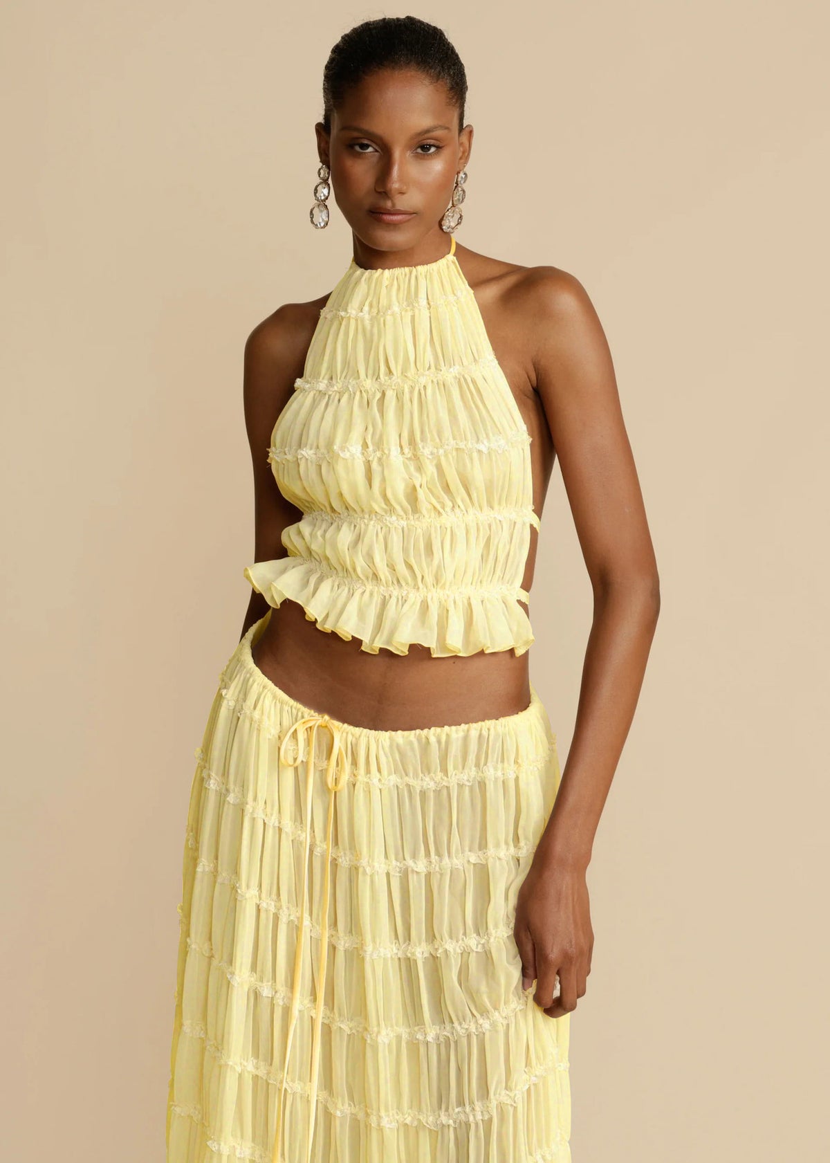 Marlowe shirred halter top and long skirt set in yellow, worn - Lia Dora