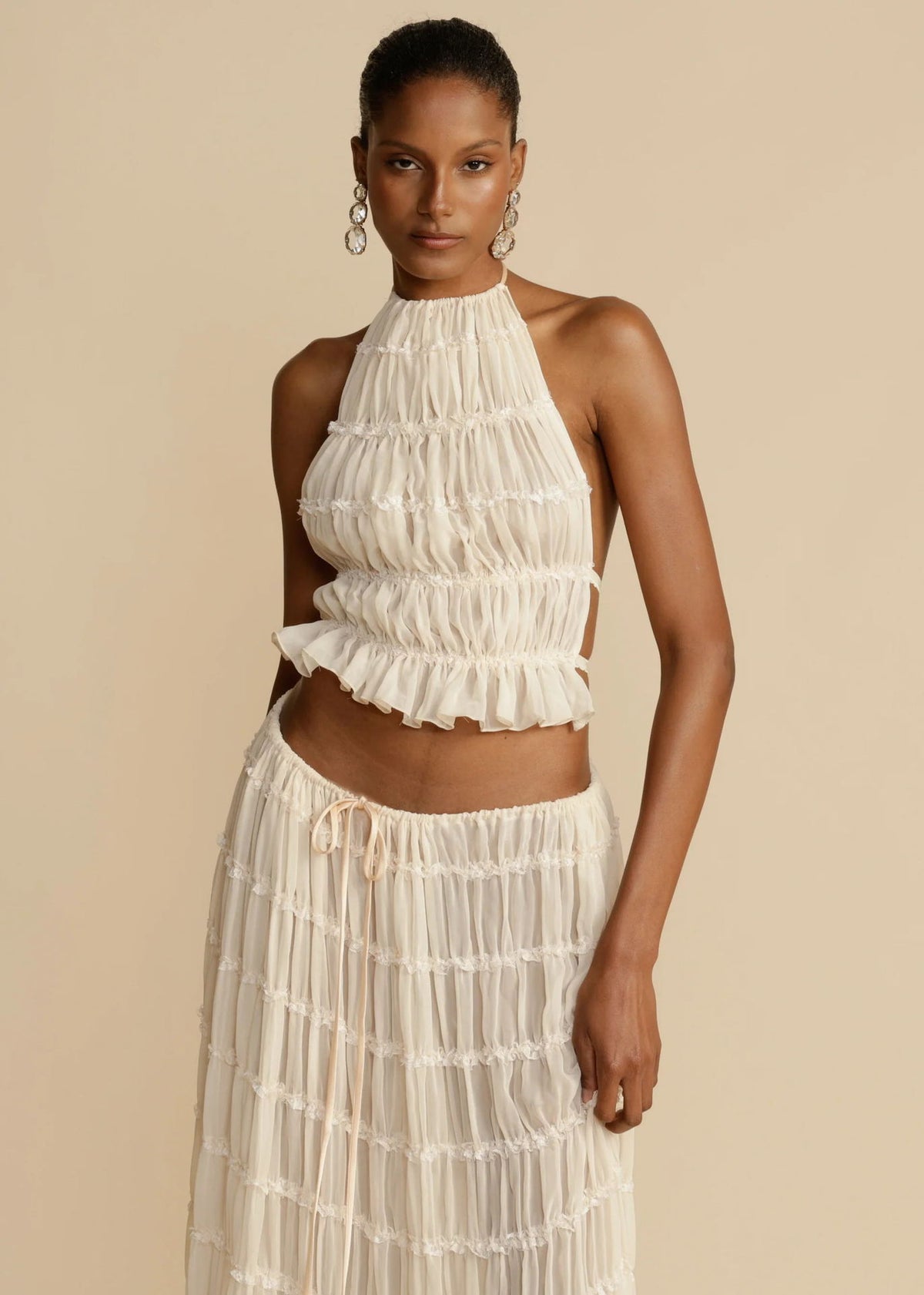 Marlowe shirred halter top and long skirt set in cream, worn - Lia Dora