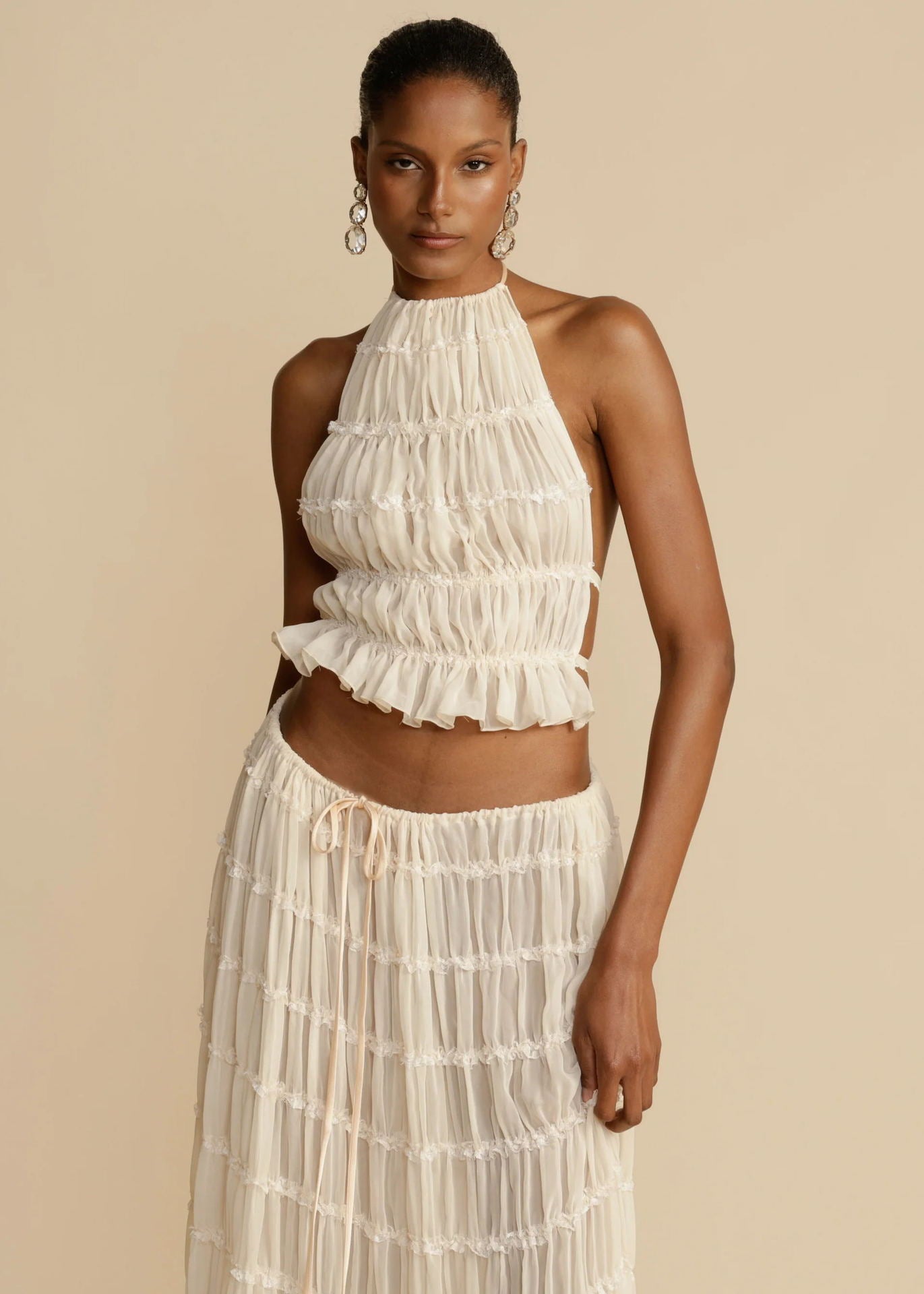 Marlowe shirred halter top and long skirt set in cream, worn - Lia Dora
